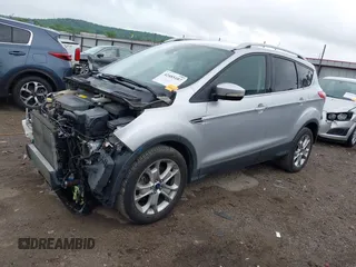 2015 Ford Escape Titanium with VIN 1FMCU0JX7FUB60418, listed as a IAAI auction lot 42485107 with 82,172 mi miles and . Bid and sale history available at DreamBid. Image 2.