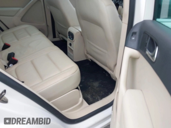 2010 Volkswagen Tiguan with VIN WVGBV9AX2AW513478, listed as a IAAI auction lot 42607466 with 63,780 mi miles and . Bid and sale history available at DreamBid. Image 8.