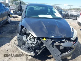 2017 Ford Focus S z VIN 1FADP3E29HL269607, wystawiony jako IAAI lot #41654836 z przebiegiem 101 645 mil mil oraz . Historia ofert i sprzedaży dostępna na DreamBid. Obrazek 6.
