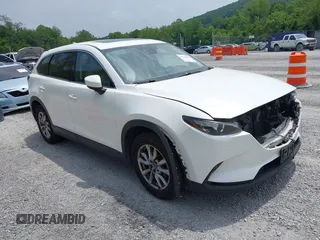 2016 Mazda CX-9 Touring with VIN JM3TCBCY1G0116889, listed as a IAAI auction lot 42394821 with 210,861 mi miles and . Bid and sale history available at DreamBid. Image 1.