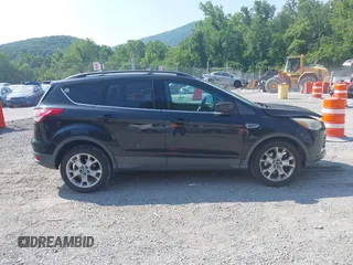 2013 Ford Escape SE z VIN 1FMCU9GX5DUA19887, wystawiony jako IAAI lot #42580986 z przebiegiem 169 407 mil mil oraz . Historia ofert i sprzedaży dostępna na DreamBid. Obrazek 13.