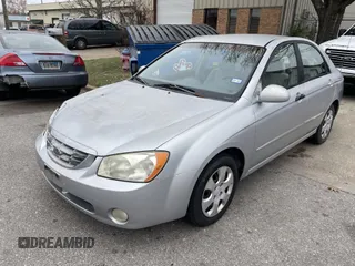 2004 Kia Spectra LX with VIN KNAFE121845043143, listed as a IAAI auction lot 41574523 with 211,758 mi miles. Bid and sale history available at carsss.com. Image 2.