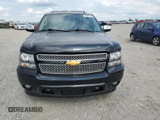 2014 Chevrolet Tahoe LTZ with VIN 1GNSKCE0XER228028, listed as a Copart auction lot 56971135 with 155,285 mi miles and Salvage title. Bid and sale history available at DreamBid. Image 5.