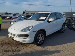 2014 Porsche Cayenne with VIN WP1AA2A23ELA97180, listed as a IAAI auction lot 42072423 with 143,374 mi miles and . Bid and sale history available at DreamBid. Image 18.