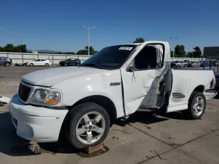 2001 Ford F-150 Lightning with VIN 2FTZF07331CA46311, listed as a Copart auction lot 61163775 with 115,382 mi miles and Salvage title. Bid and sale history available at DreamBid. Image 1.