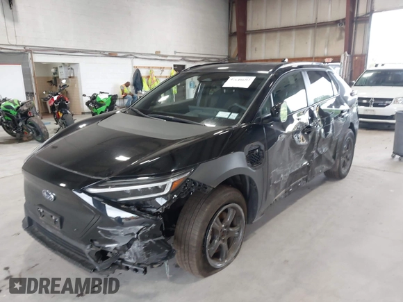 2024 Subaru Solterra Touring with VIN JTMABABA9RA052065, listed as a IAAI auction lot 42648692 with 13,880 mi miles and . Bid and sale history available at DreamBid. Image 2.