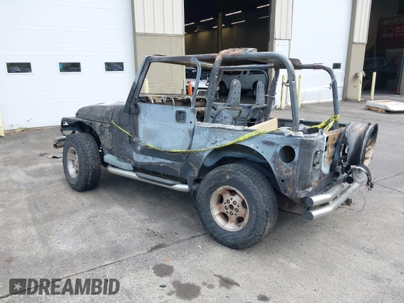 2000 Jeep Wrangler Sport with VIN 1J4FA49S5YP797345, listed as a IAAI auction lot 40322775 with Not Provided miles and . Bid and sale history available at DreamBid. Image 3.