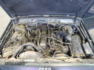 1996 Jeep Cherokee Sport with VIN 1J4FJ68S8TL282160, listed as a Copart auction lot 70670014 with 217,003 mi miles and Clean Title. Bid and sale history available at carsss.com. Image 11.