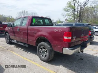 2005 Ford F-150 XLT with VIN 1FTPX14575KD79404, listed as a IAAI auction lot 42003073 with 212,050 mi miles. Bid and sale history available at carsss.com. Image 3.