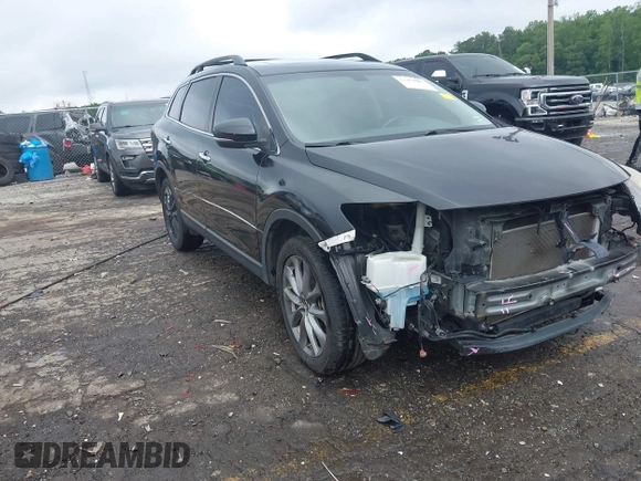 2015 Mazda CX-9 Grand Touring with VIN JM3TB2DA1F0464517, listed as a IAAI auction lot 42484985 with 104,932 mi miles and . Bid and sale history available at DreamBid. Image 1.