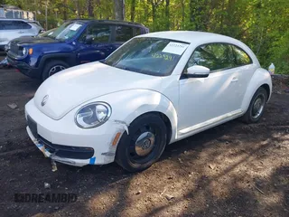 2012 Volkswagen Beetle 2.5L w/Sound/Nav PZEV with VIN 3VWJP7AT1CM619318, listed as a IAAI auction lot 42223291 with 85,989 mi miles and . Bid and sale history available at DreamBid. Image 2.