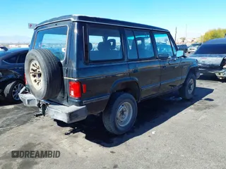 1990 Mitsubishi Montero z VIN JA4GJ51S9LJ002086, wystawiony jako IAAI lot #41643120 z przebiegiem 198 215 mil mil oraz . Historia ofert i sprzedaży dostępna na DreamBid. Obrazek 4.