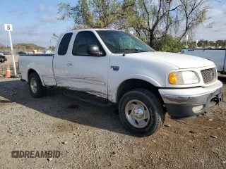 2000 Ford F-150 XL with VIN 2FTRX18L2YCA44464, listed as a Copart auction lot 51081335 with Not provided miles and Salvage title. Bid and sale history available at DreamBid. Image 4.