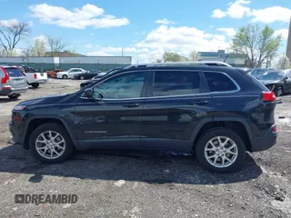 2014 Jeep Cherokee Latitude with VIN 1C4PJMCS8EW257959, listed as a IAAI auction lot 41987529 with 124,749 mi miles. Bid and sale history available at carsss.com. Image 15.