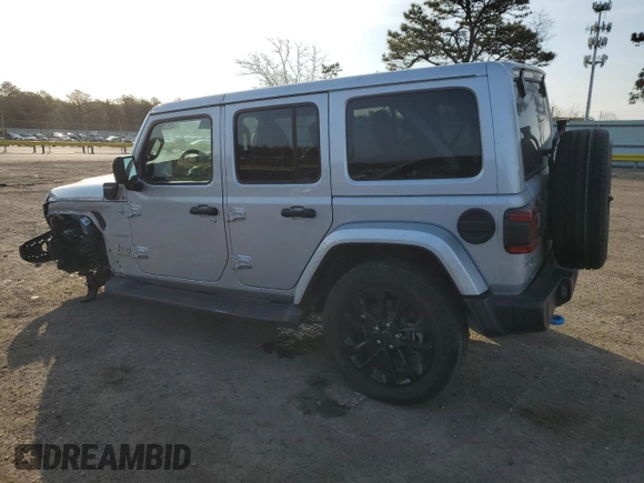 2024 Jeep Wrangler Sahara with VIN 1C4RJXP60RW128448, listed as a Copart auction lot 48658135 with 5,879 mi miles and Salvage Title. Bid and sale history available at DreamBid. Image 2.