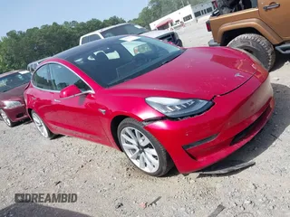 2020 Tesla Model 3 Standard Range Plus with VIN 5YJ3E1EA9LF708808, listed as a IAAI auction lot 40018323 with 32,069 mi miles. Bid and sale history available at carsss.com. Image 1.