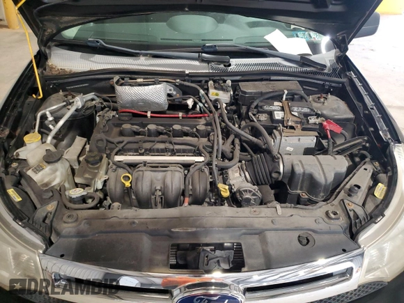 2008 Ford Focus SE z VIN 1FAHP35N98W121449, wystawiony jako Copart lot #60323735 z przebiegiem 83 990 mil mil oraz Czysty tytuł • Clean title. Historia ofert i sprzedaży dostępna na DreamBid. Obrazek 11.