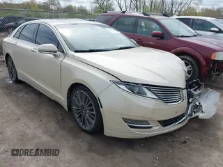 2014 Lincoln MKZ z VIN 3LN6L2JK7ER821385, wystawiony jako IAAI lot #42114154 z przebiegiem 141 480 mil mil oraz . Historia ofert i sprzedaży dostępna na DreamBid. Obrazek 1.
