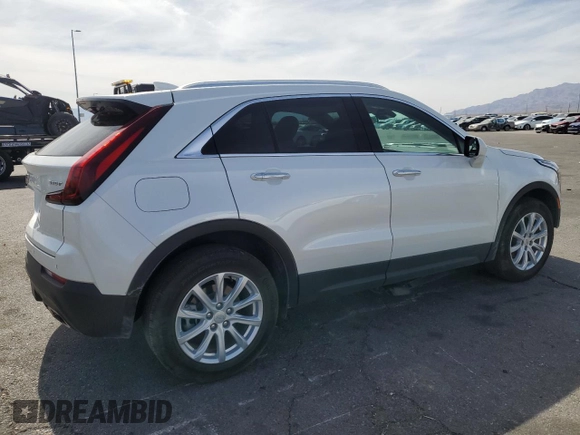 2023 Cadillac XT4 FWD Luxury with VIN 1GYAZAR46PF134602, listed as a Copart auction lot 54684865 with 13,221 mi miles and Salvage title. Bid and sale history available at DreamBid. Image 3.