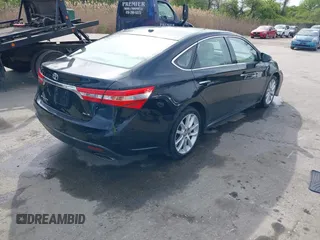2014 Toyota Avalon Limited with VIN 4T1BK1EB5EU129821, listed as a IAAI auction lot 42085414 with 113,729 mi miles. Bid and sale history available at carsss.com. Image 4.