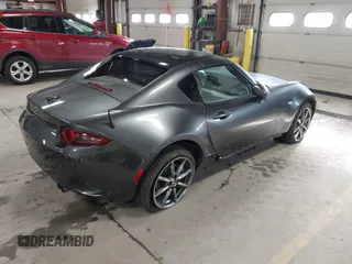 2021 Mazda MX-5 Miata Grand Touring with VIN JM1NDAM73M0451484, listed as a IAAI auction lot 41485044 with 11,328 mi miles and . Bid and sale history available at DreamBid. Image 4.