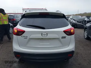2016 Mazda CX-5 Grand Touring with VIN JM3KE4DY3G0838204, listed as a IAAI auction lot 41961049 with 98,918 mi miles and . Bid and sale history available at carsss.com. Image 16.