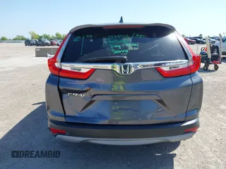 2019 Honda CR-V EX with VIN 5J6RW1H58KA042502, listed as a IAAI auction lot 42001700 with 117,396 mi miles and . Bid and sale history available at DreamBid. Image 6.