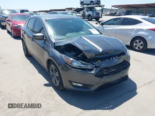 2018 Ford Focus SE z VIN 1FADP3FE3JL204220, wystawiony jako IAAI lot #41972960 z przebiegiem 62 682 mil mil oraz . Historia ofert i sprzedaży dostępna na DreamBid. Obrazek 1.