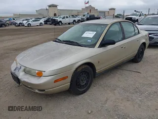 2002 Saturn SL z VIN 1G8ZK52732Z131361, wystawiony jako IAAI lot #42358215 z przebiegiem 228 184 mil mil oraz . Historia ofert i sprzedaży dostępna na DreamBid. Obrazek 2.