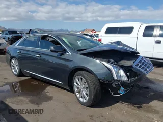 2013 Cadillac XTS Luxury z VIN 2G61P5S31D9182553, wystawiony jako IAAI lot #42076227 z przebiegiem 116 849 mil mil oraz . Historia ofert i sprzedaży dostępna na DreamBid. Obrazek 1.