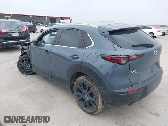 2023 Mazda CX-30 S Carbon Edition with VIN 3MVDMBCM0PM532449, listed as a IAAI auction lot 41799255 with 60,604 mi miles and . Bid and sale history available at DreamBid. Image 3.