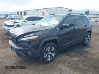 2016 Jeep Cherokee Trailhawk with VIN 1C4PJMBS4GW169267, listed as a IAAI auction lot 42597291 with 79,258 mi miles and . Bid and sale history available at DreamBid. Image 2.