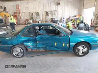 1994 Pontiac Grand Am z VIN 1G2NE15M5RM500643, wystawiony jako IAAI lot #42069901 z przebiegiem 77 129 mil mil oraz . Historia ofert i sprzedaży dostępna na DreamBid. Obrazek 6.