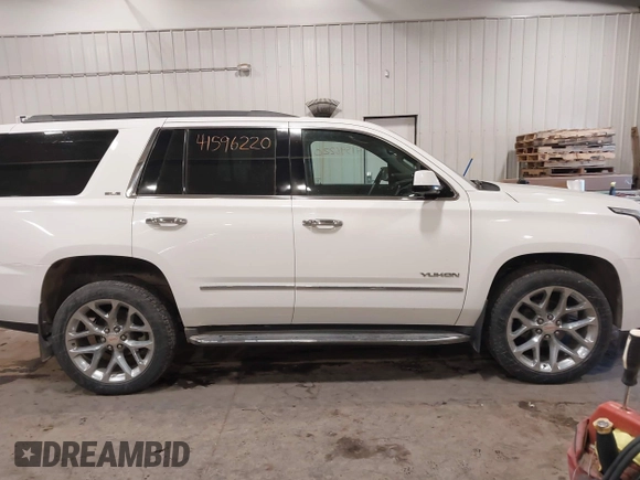 2015 GMC Yukon SLE with VIN 1GKS2AKC6FR103447, listed as a IAAI auction lot 41596220 with 104,209 mi miles. Bid and sale history available at carsss.com. Image 13.