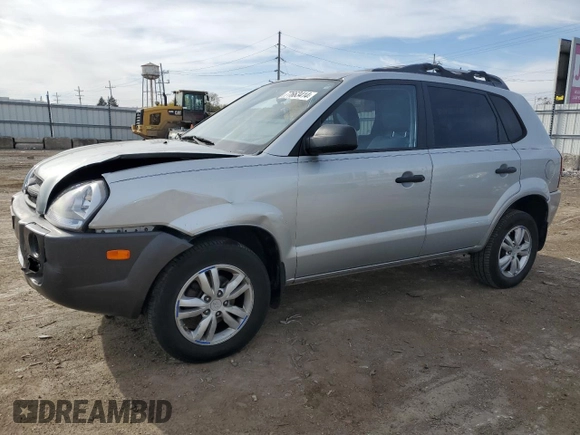 2009 Hyundai Tucson GLS with VIN KM8JM12B79U012399, listed as a Copart auction lot 77663414 with 164,615 mi miles and Salvage Title. Bid and sale history available at carsss.com. Image 1.