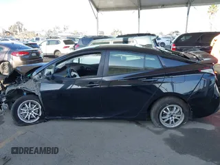 2021 Toyota Prius L Eco with VIN JTDKAMFU2M3134178, listed as a IAAI auction lot 41975477 with 26,936 mi miles. Bid and sale history available at carsss.com. Image 14.