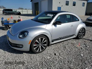 2012 Volkswagen Beetle 2.0T Turbo w/Sun/Snd/Nav PZEV with VIN 3VWVA7AT6CM662796, listed as a Copart auction lot 51649775 with 61,785 mi miles and Clean Title. Bid and sale history available at carsss.com. Image 1.
