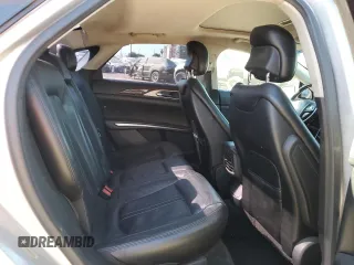 2015 Lincoln MKZ z VIN 3LN6L2G9XFR610736, wystawiony jako Copart lot #80662274 z przebiegiem 101 441 mil mil oraz Szkoda całkowita • Salvage title. Historia ofert i sprzedaży dostępna na DreamBid. Obrazek 10.