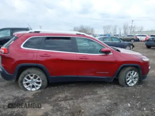 2014 Jeep Cherokee Latitude with VIN 1C4PJMCS0EW261021, listed as a IAAI auction lot 41986701 with 114,633 mi miles. Bid and sale history available at carsss.com. Image 10.