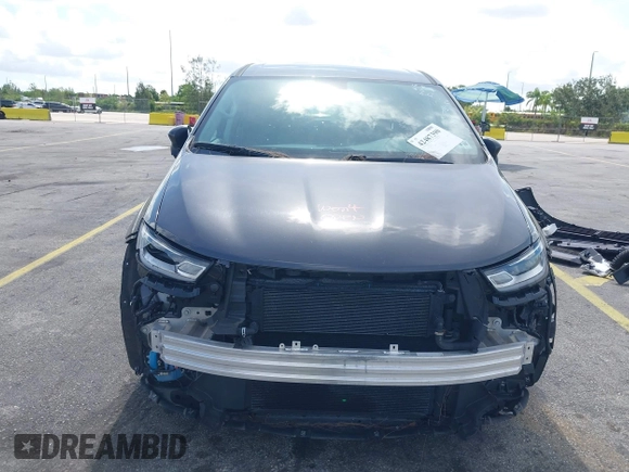 2023 Chrysler Pacifica Hybrid Touring L with VIN 2C4RC1L74PR579782, listed as a IAAI auction lot 42487390 with Not provided miles and . Bid and sale history available at DreamBid. Image 13.