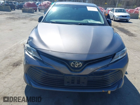 2019 Toyota Camry LE z VIN 4T1B11HK9KU245615, wystawiony jako IAAI lot #42066968 z przebiegiem 130 042 mil mil oraz . Historia ofert i sprzedaży dostępna na DreamBid. Obrazek 13.