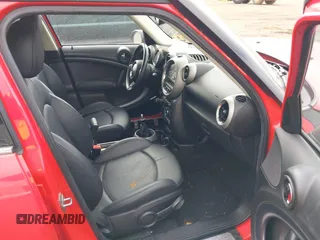 2012 MINI Countryman S z VIN WMWZC3C52CWM26424, wystawiony jako IAAI lot #41828011 z przebiegiem 145 678 mil mil oraz . Historia ofert i sprzedaży dostępna na DreamBid. Obrazek 5.