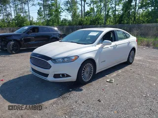 2014 Ford Fusion Titanium Hybrid with VIN 3FA6P0RU3ER279212, listed as a IAAI auction lot 42241465 with 155,841 mi miles and . Bid and sale history available at DreamBid. Image 2.