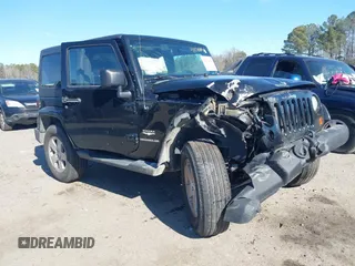 2012 Jeep Wrangler Sahara z VIN 1C4GJWBGXCL104006, wystawiony jako IAAI lot #41470054 z przebiegiem 148 472 mil mil oraz . Historia ofert i sprzedaży dostępna na DreamBid. Obrazek 1.