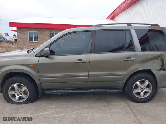 2007 Honda Pilot EX-L with VIN 2HKYF18767H538207, listed as a IAAI auction lot 41747624 with 214,026 mi miles. Bid and sale history available at carsss.com. Image 15.