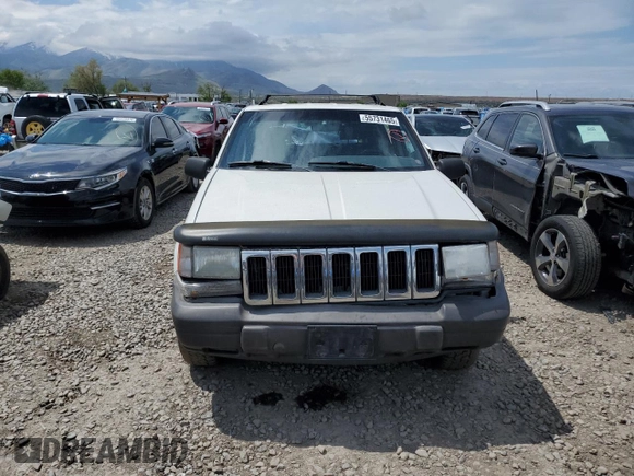 1998 Jeep Grand Cherokee Laredo with VIN 1J4GZ58S4WC244954, listed as a Copart auction lot 55731465 with 205,766 mi miles and Salvage title. Bid and sale history available at DreamBid. Image 5.