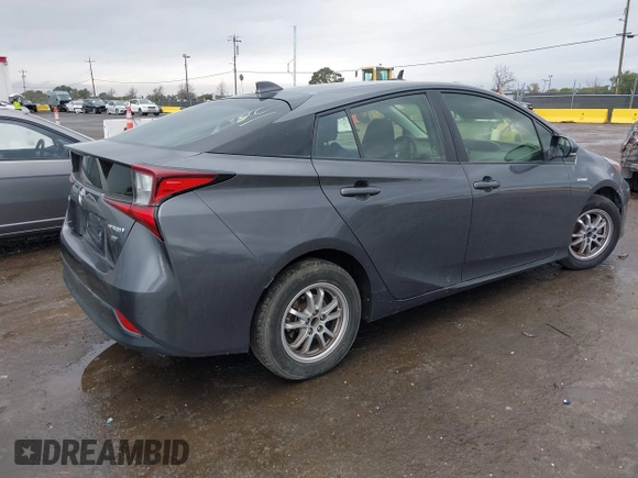 2021 Toyota Prius L Eco with VIN JTDKAMFUXM3143646, listed as a IAAI auction lot 41507110 with 207,238 mi miles. Bid and sale history available at carsss.com. Image 4.