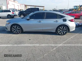 2024 Honda Civic EX-L z VIN 19XFL1H70RE022707, wystawiony jako IAAI lot #41852356 z przebiegiem 23 137 mil mil oraz . Historia ofert i sprzedaży dostępna na DreamBid. Obrazek 14.
