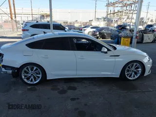 2023 Audi A5 Sportback Premium z VIN WAUABCF5XPA056452, wystawiony jako IAAI lot #41644537 z przebiegiem 14 918 mil mil oraz . Historia ofert i sprzedaży dostępna na DreamBid. Obrazek 14.