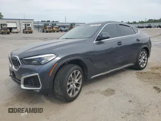 2020 BMW X6 xDrive40i z VIN 5UXCY6C03L9B94299, wystawiony jako Copart lot #53857965 z przebiegiem 54 133 mil mil oraz Szkody całkowita. Historia ofert i sprzedaży dostępna na DreamBid. Obrazek 1.